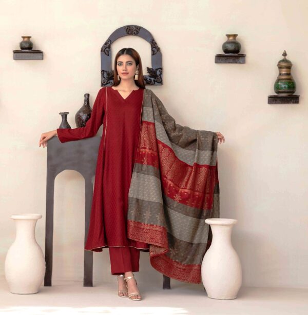 Model in maroon embroidered kurta with matching dupatta.